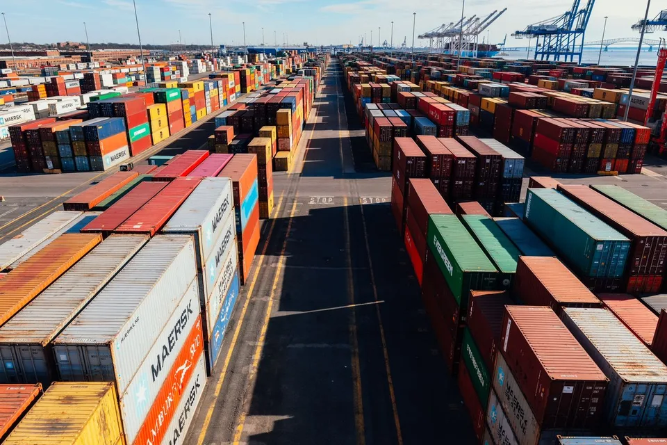 Logistics terminal with organized containers reflecting security, punctuality, efficiency, and operational commitment